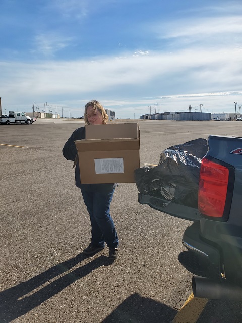 Pulling box of baits from truck