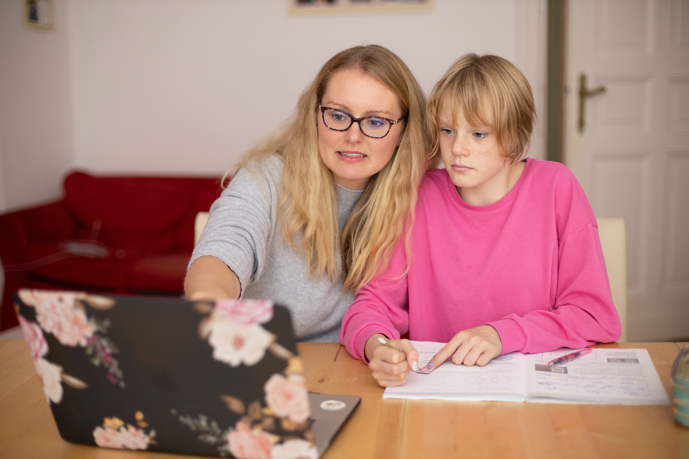 Parent and teen looking at a computer.